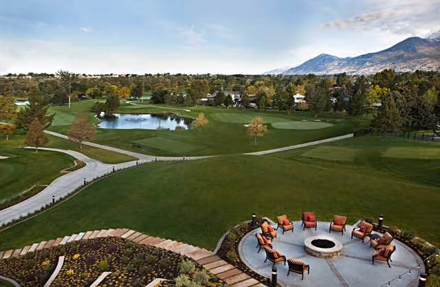 Beautiful golf course surrounded by trees and mountains in Utah Valley.
