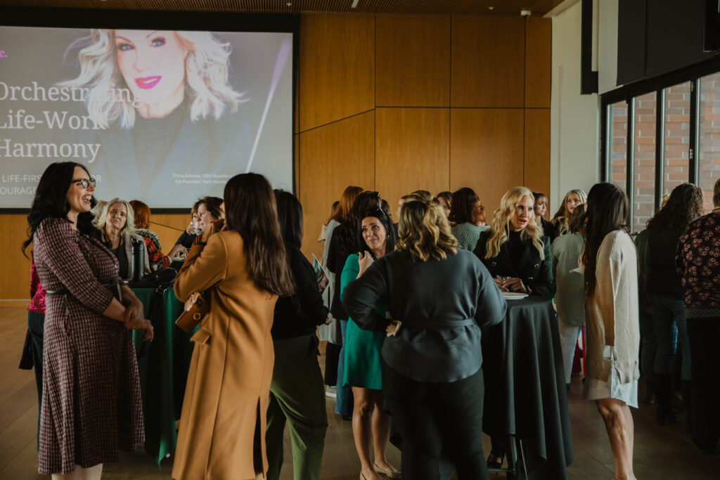 Women networking and conversing at a Utah Valley Women’s Business Network event.